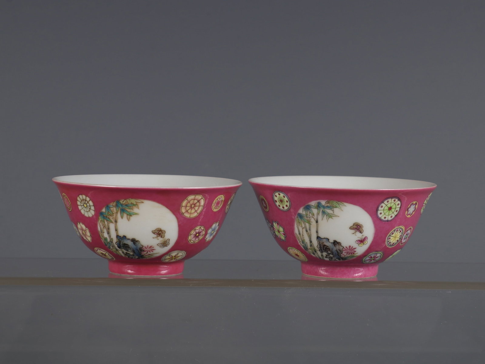 A Pair of Exquisite Ruby Red-Ground Famille-Rose Flower,Bats and Peach Pattern Bowls: A Pair of Exquisite Ruby Red-Ground Famille-Rose Flower,Bats and Peach Pattern Bowls,Qing Dynasty, China,Yongzheng Four-character Mark,Size:1.8inx3.6in一对胭脂红地&