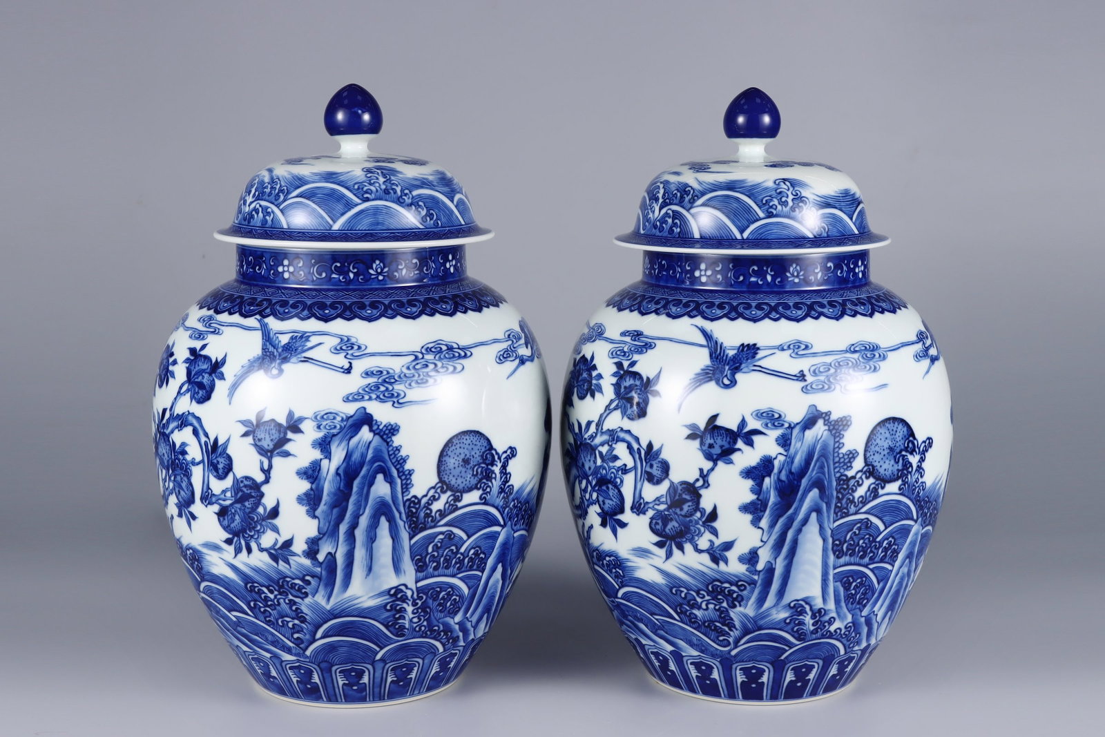 A Pair of Rare Blue and White Seawater,Pine and Deer Pattern Cover Jars: A Pair of Rare Blue and White Seawater,Pine and Deer Pattern Cover Jars,Qing Dynasty, China,Yongzheng Six-character Mark,Size:13.8inx8.3inx4.7in一对青花海水松