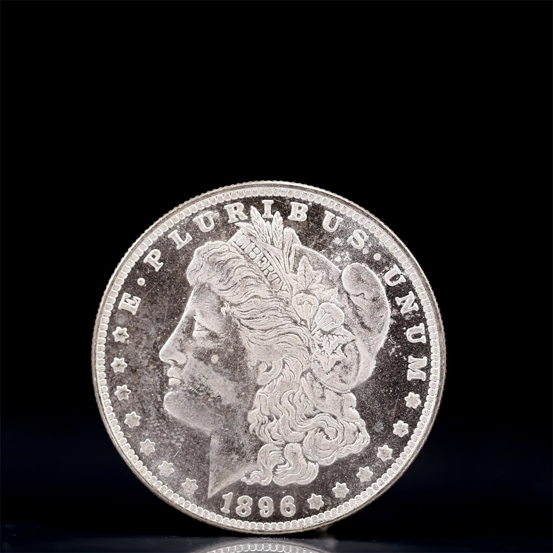 USA Morgan Dollar 1896 Coin: Obv: profile bust with date below and E PLURIBUS UNUM legend and stars around. Rev: eagle with In God we trust above within wreath with UNITED STATES OF AMERICA ONE DOLLAR legend. IN GOD WE TRUST / LI
