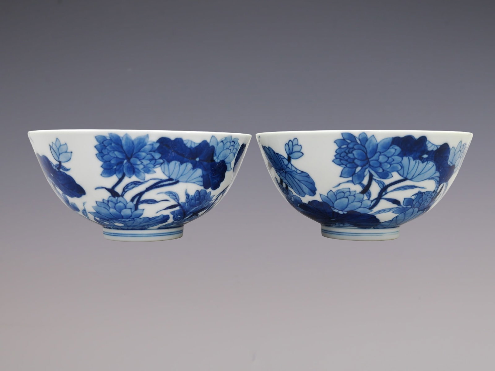 A Pair of Exquisite Blue and White Famille-Rose Lotus Pattern Bowls: A Pair of Exquisite Blue and White Famille-Rose Lotus Pattern Bowls,Qing Dynasty, China,Yongzheng Six-character Mark,Size:2.8inx5.7in一对青花粉彩荷花