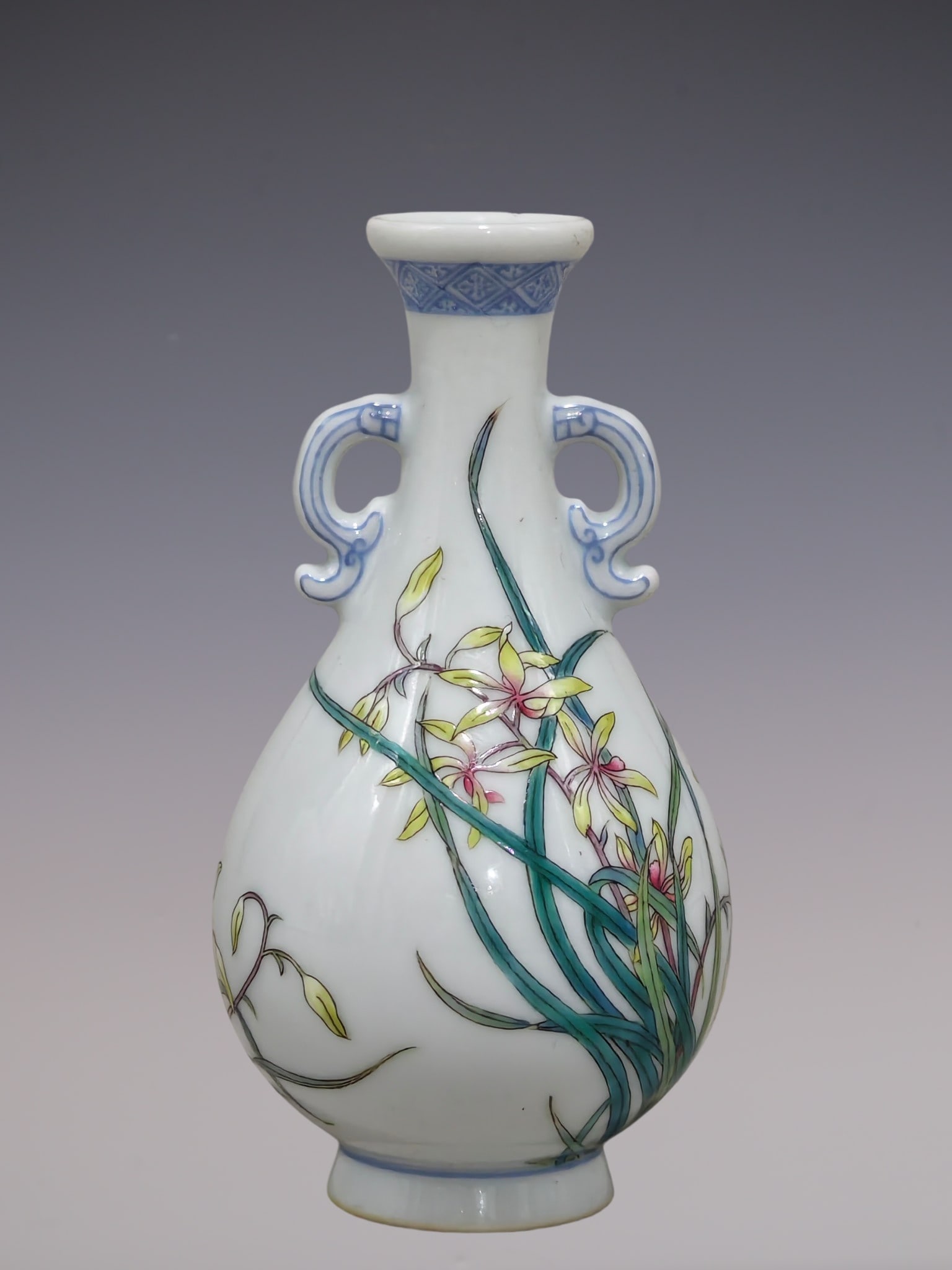 An Exquisite Enamel Orchid Pattern Double-Ears Vase,With Poem: An Exquisite Enamel Orchid Pattern Double-Ears Vase,With Poem,Qing Dynasty, China,Qianlong Four-character Mark,Size:3.9inx2.4in珐琅彩兰花纹双耳瓶,