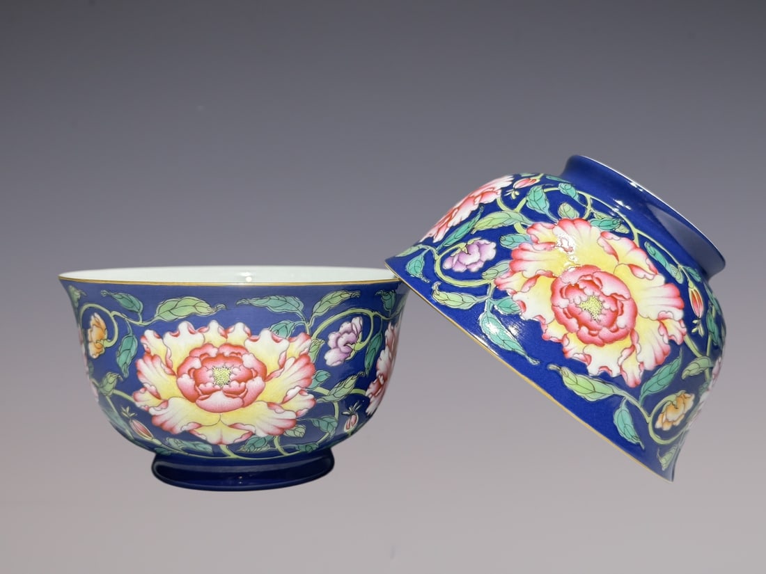 A Pair of Exquisite Enamel Blue Ground Painted Gold Peony Pattern Bowls: A Pair of Exquisite Enamel Blue Ground Painted Gold Peony Pattern Bowls,Qing Dynasty, China,Qianlong Six-character Mark,Size:2.4inx4.3in一对珐琅彩蓝地描