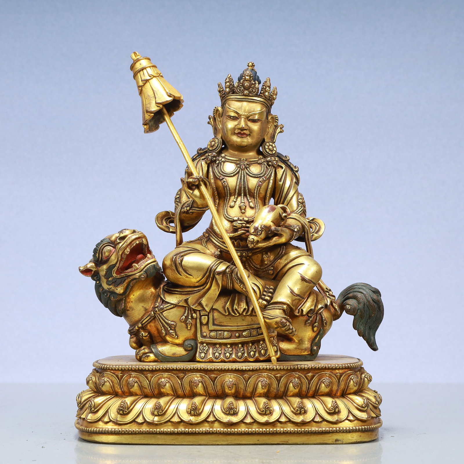 A Exquisite Gilt Bronze Statue of Mammon Rides the Lion: A Exquisite Gilt Bronze Statue of Mammon Rides the Lion Ming Dynasty, China Size:8.7inx5.5inx11.4in Weight:6550g铜鎏金骑狮财神