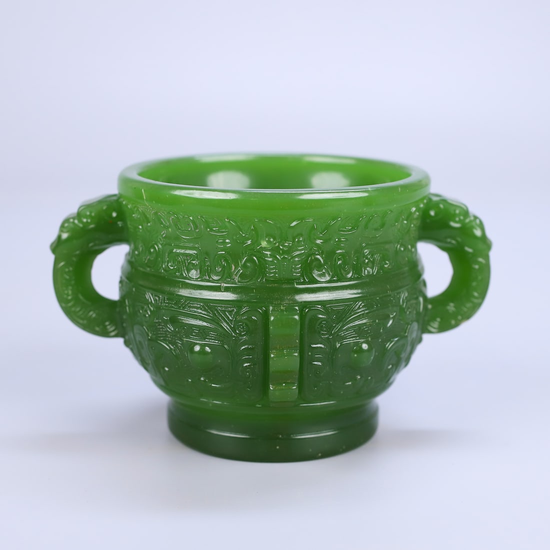 An Exquisite Glass Beast-Face Pattern Double-Ears Cup: An Exquisite Glass Beast-Face Pattern Double-Ears Cup,Qing Dynasty,China,Size:3.1inx5.1in,Weight:445g琉璃兽面纹双耳杯，中国清