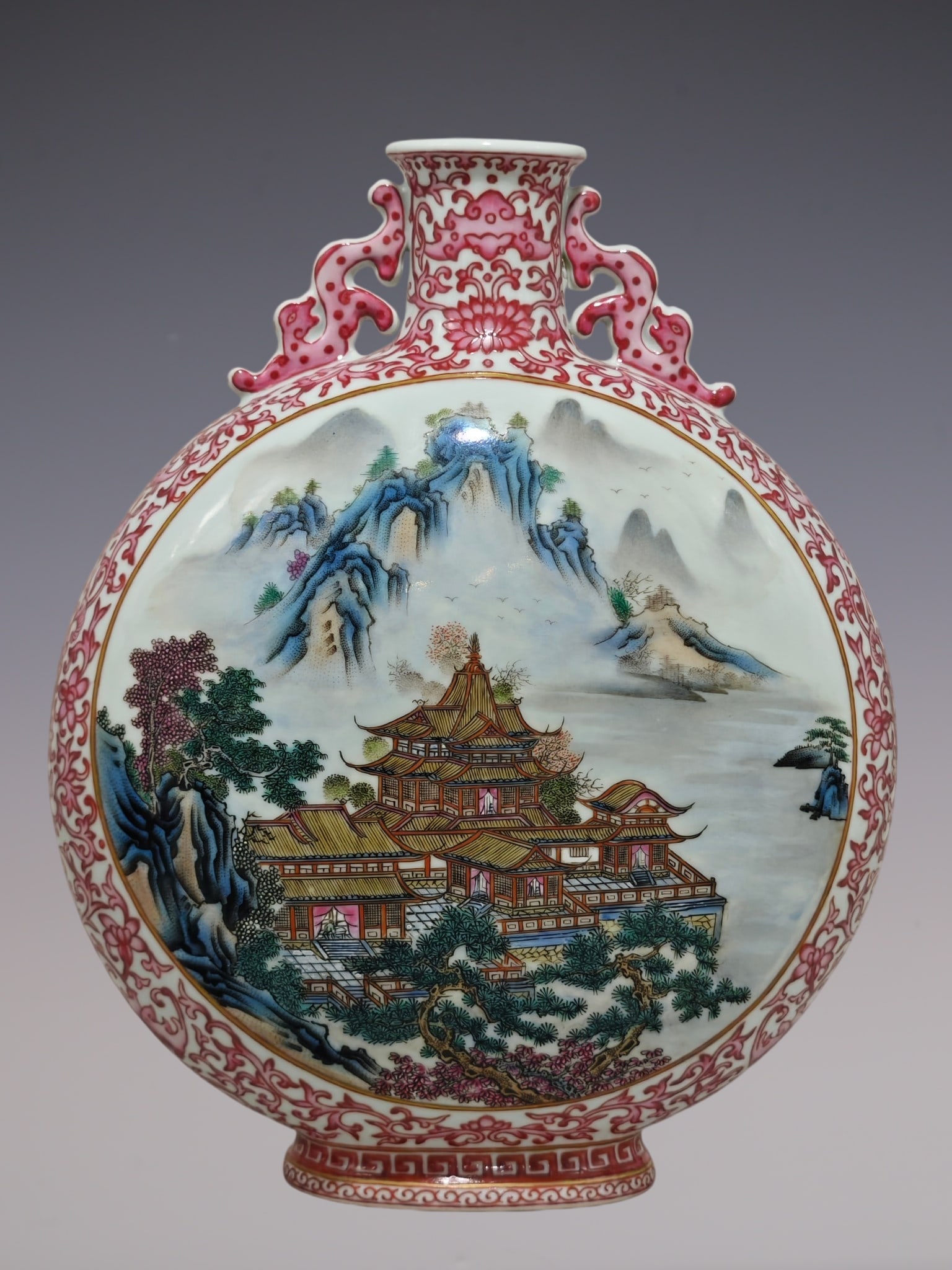 A Rare Ruby Red-Glazed Famille-Rose Landscape and Figure Pattern Dragon-Ears Vase: A Rare Ruby Red-Glazed Famille-Rose Landscape and Figure Pattern Dragon-Ears Vase,Qing Dynasty, China,Qianlong Six-character