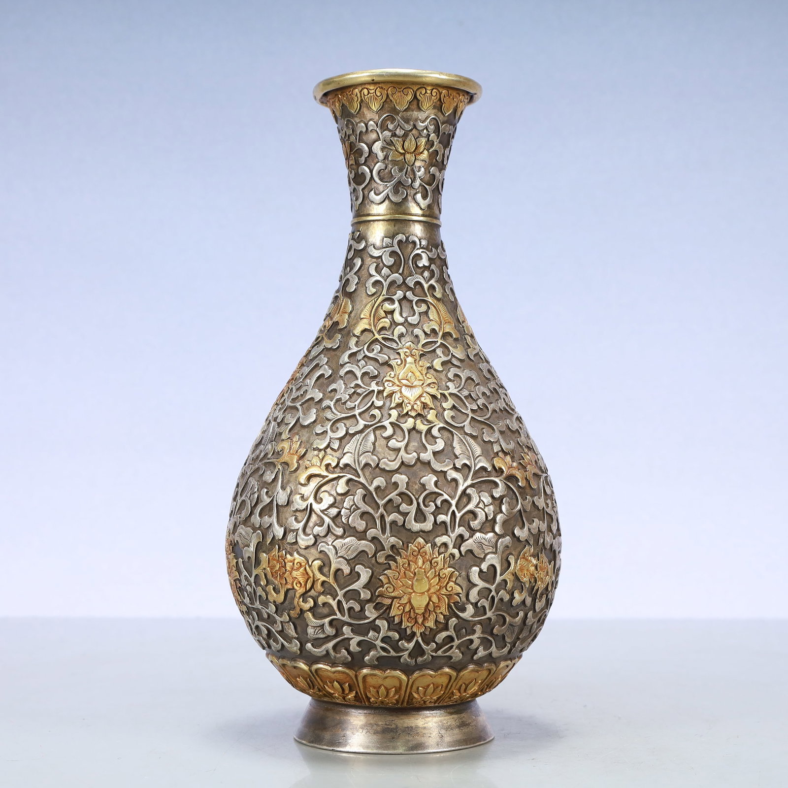 A Exquisite Gilt Silver Lotus Pattern Vase: A Exquisite Gilt Silver Lotus Pattern Vase Tang Dynasty, China Size:5.7inx11in Weight:1100g铜鎏金银缠枝莲纹瓶 中国唐代