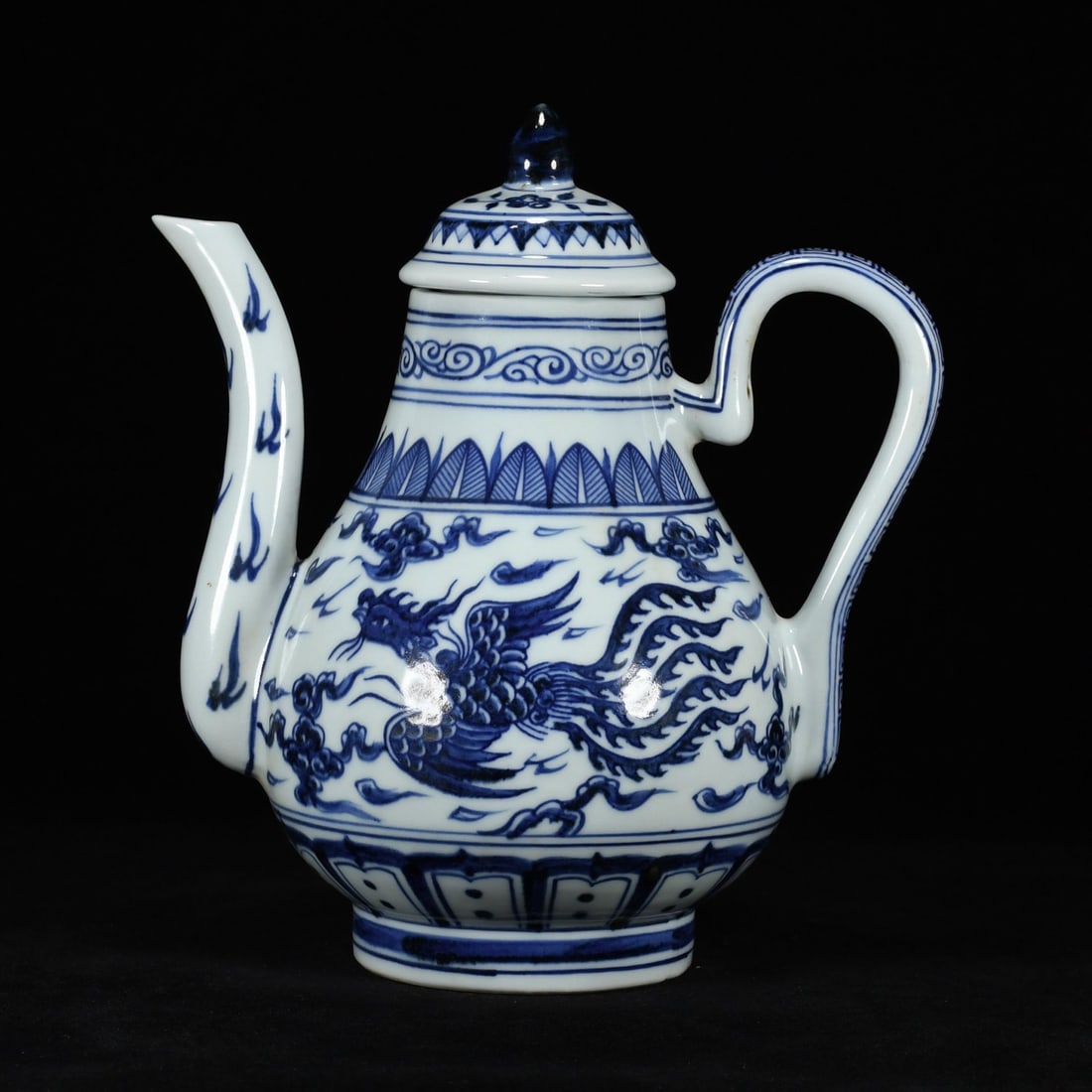 An Exquisite Blue and White Phoenix Pattern Ewer: An Exquisite Blue and White Phoenix Pattern Ewer,Ming Dynasty, China,Xuande Six-character Mark,Size:9.8inx8.7in