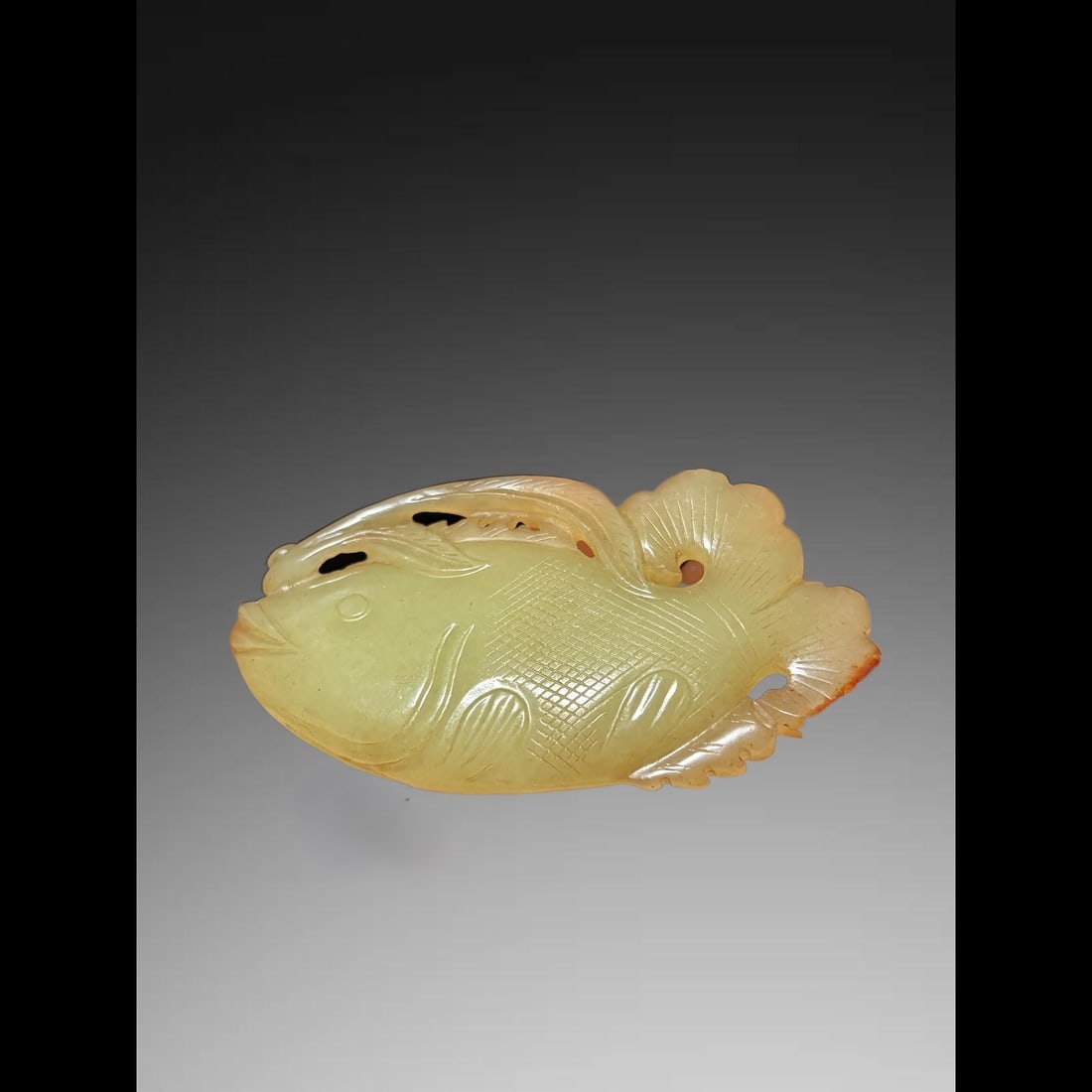 An Exquisite Hotan Yellow Jade Fish Ornament: An Exquisite Hotan Yellow Jade Fish Ornament,Qing Dynasty, China,Size:3inx1.7inx0.4in,Weight:46.4g 和田黄玉鱼摆件,中国清代