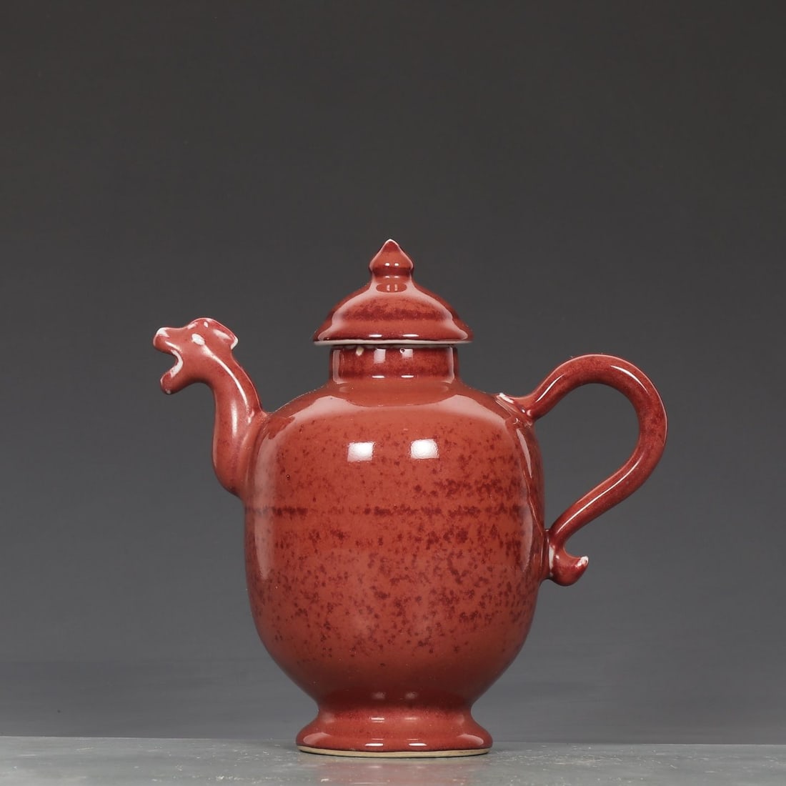 An Exquisite Ruby Red Glazed Dragon Head Ewer: An Exquisite Ruby Red Glazed Dragon Head Ewer,Ming Dynasty, China,Xuande Six-character Mark,Size:7.9inx2inx4.5in 宝石红釉龙首壶,中国明ߣ