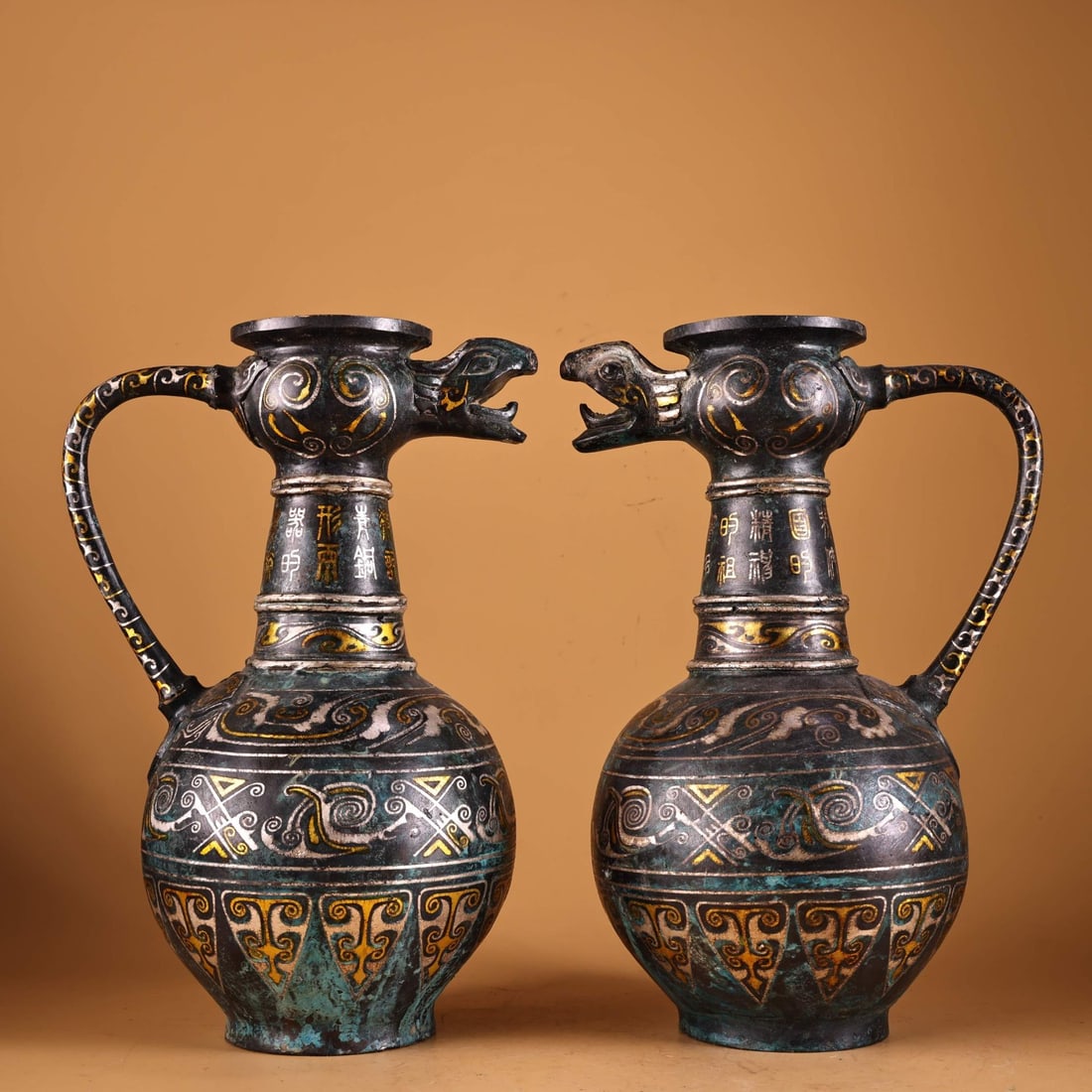 A pair of Exquisite Bronze Inlaid With Gold Silver Snake-Mouth Ewer: A pair of Exquisite Bronze Inlaid With Gold Silver Snake-Mouth Ewer,Han Dynasty, China,Size:7.1inx7.1in,Weight:1700g