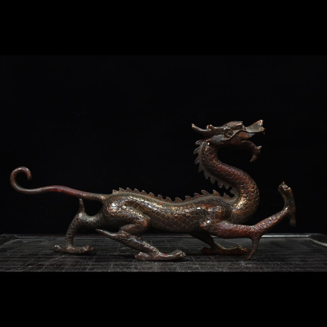 An Exquisite Bronze Slurried-Gold Dragon Ornament: An Exquisite Bronze Slurried-Gold Dragon Ornament,Qing Dynasty, China,Size:5.9inx12.2inx2.4in,Weight:1150g 铜泥金龙摆件,中国清代