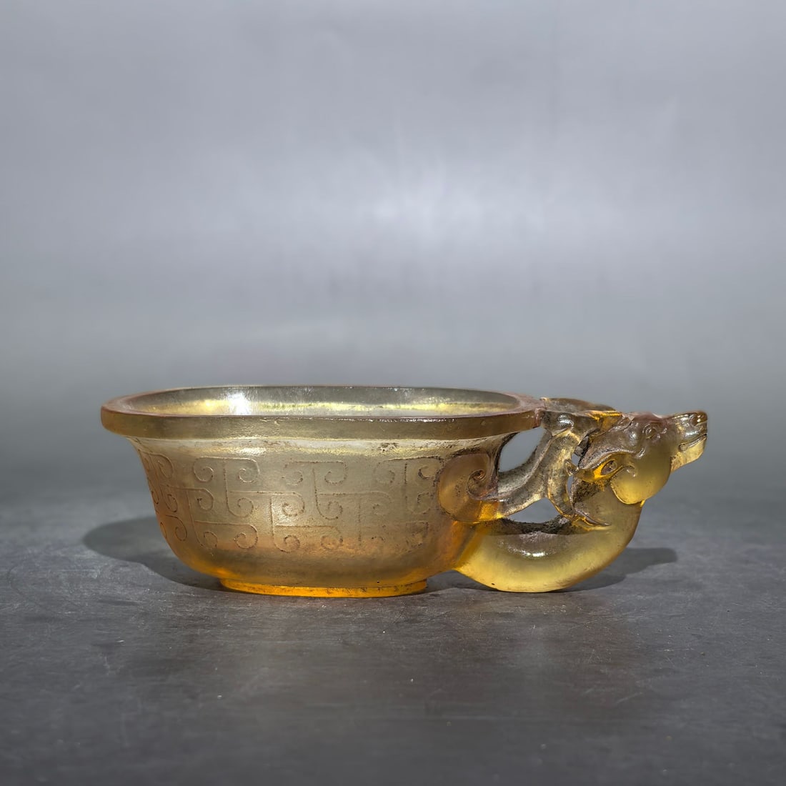 An Exquisite Glass Carved Buffalo‑Head Cup: An Exquisite Glass Carved Buffalo Head Cup,Qing Dynasty, China,Size:3.1inx4.7inx1.4in,Weight:300g 琉璃雕刻牛头杯,中国清代