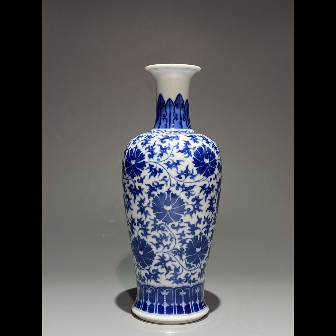 An Exquisite Blue and White Lotus Pattern Vase: An Exquisite Blue and White Lotus Pattern Vase,Qing Dynasty, China,Qianlong Six-character Mark,Size:9.8inx3.9in 青花缠枝莲纹瓶,中国清代