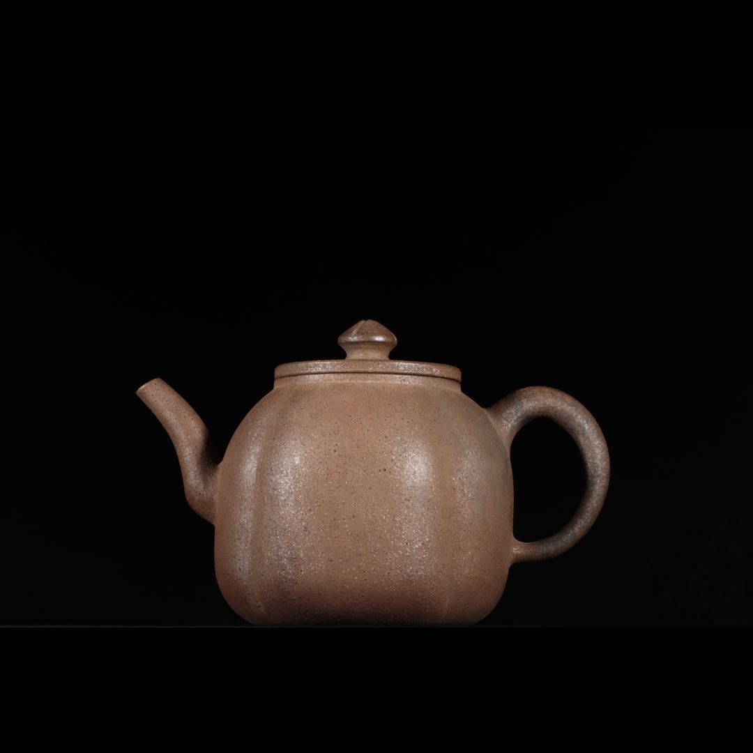 An Exquisite Zisha Melon Rib Teapot: An Exquisite Zisha Melon Rib Teapot,Ming Dynasty, China,With Mark,Size:5.6inx8.6in 紫砂瓜菱纹壶,中国明代,带款