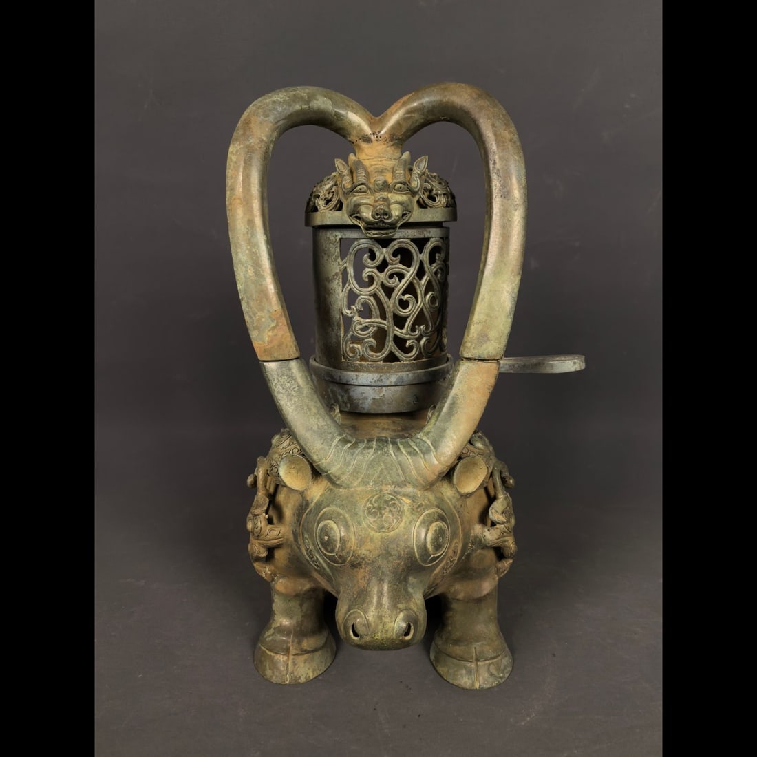 An Exquisite Bronze Dragon Pattern Buffalo‑Shaped Lamp: An Exquisite Bronze Dragon Pattern Buffalo‑Shaped Lamp,Han Dynasty, China,Size:11.8inx9.4inx6.3in,Weight:3500g 青铜龙纹牛形灯,中国汉&#