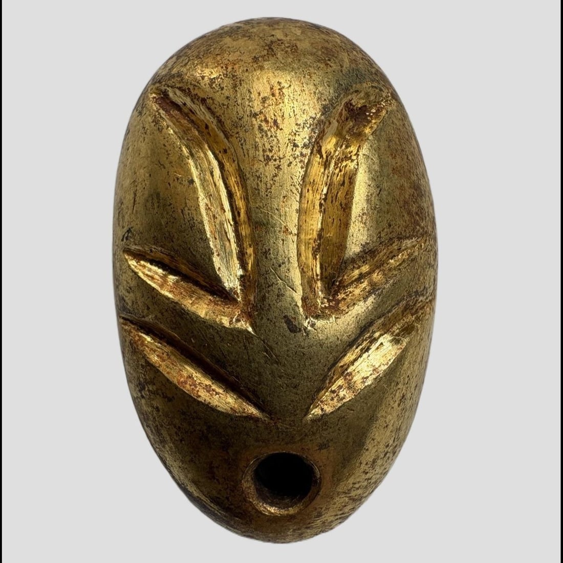 An Exquisite Gilt Bronze Coin: An Exquisite Gilt Bronze Coin,Han Dynasty, China,Size:1.3inx0.8in,Weight:25.3g 铜鎏金鬼脸金钱,中国汉代