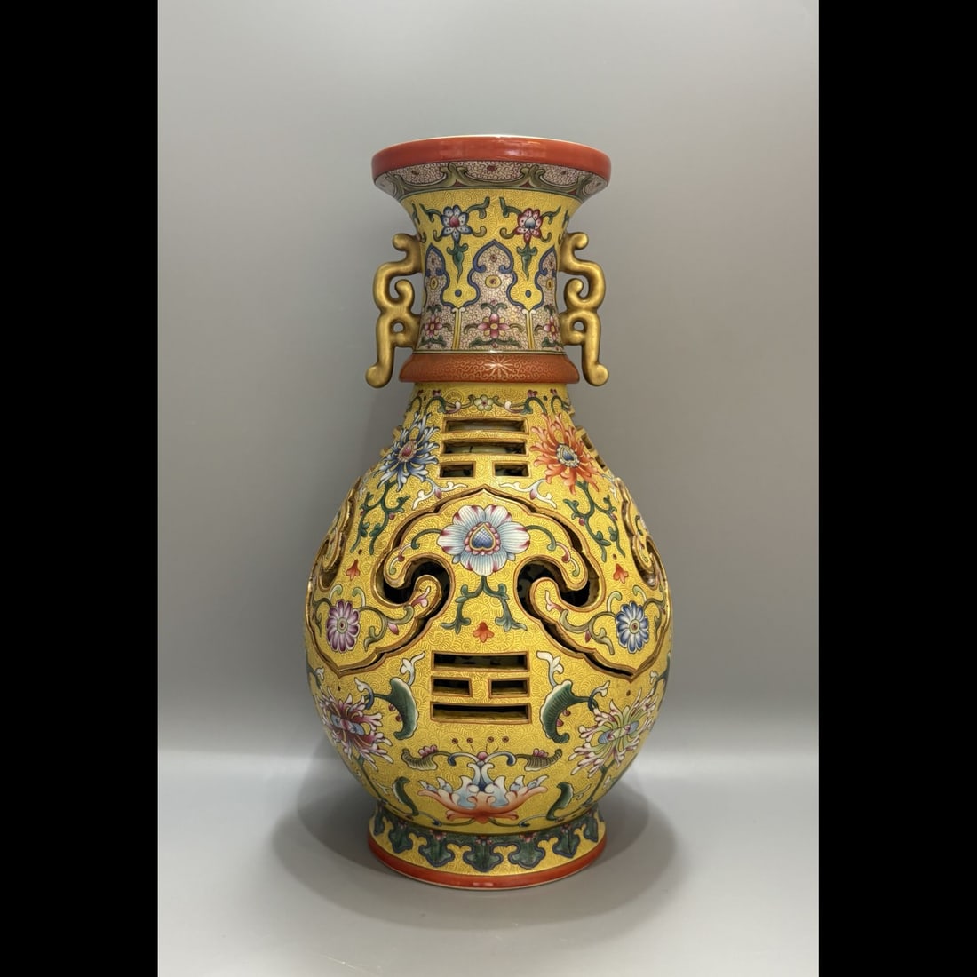 An Exquisite Yellow Ground Flower Pattern Double-Ears Vase: An Exquisite Yellow Ground Flower Pattern Double-Ears Vase,Qing Dynasty, China,Qianlong Six‑character Mark,Size:12.6inx7.9in 黄地花卉纹双耳瓶,
