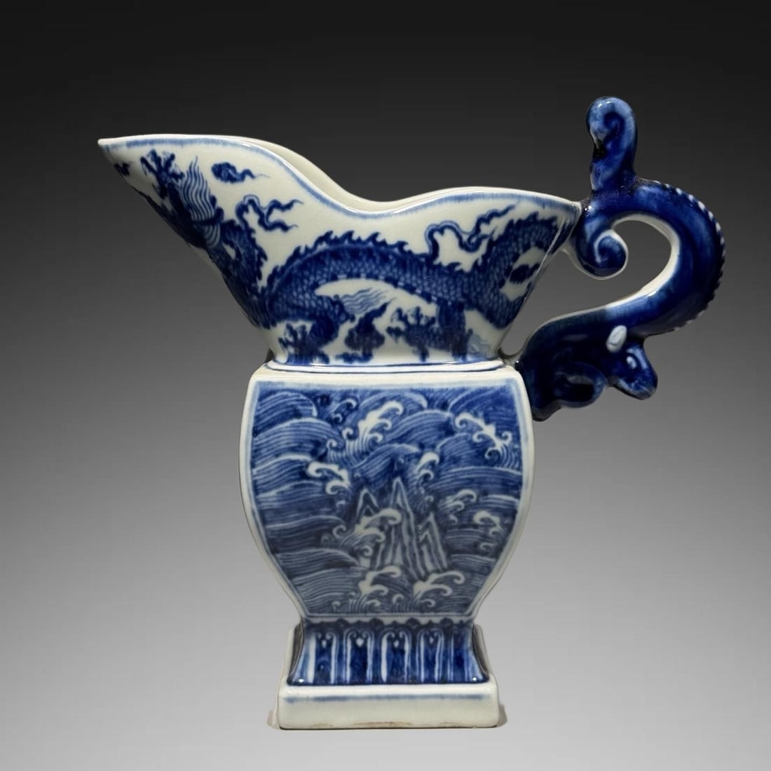 An Exquisite Blue and White Seawater Dragon Pattern Goblet: An Exquisite Blue and White Seawater Dragon Pattern Goblet,Ming Dynasty, China,Xuande Four-character Mark,Size:7.3inx6.9in 青花海水龙纹爵杯,中