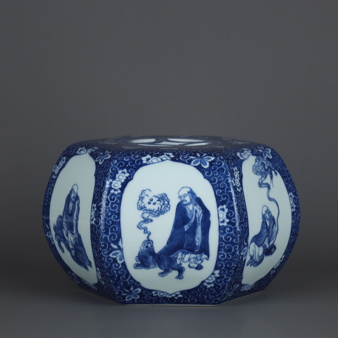 An Exquisite Blue and White Arhat Pattern Stool: An Exquisite Blue and White Arhat Pattern Stool,Qing Dynasty, China,Qianlong Six-character Mark,Size:5.7inx9.9in 青花罗汉纹绣墩,中国清ߣ
