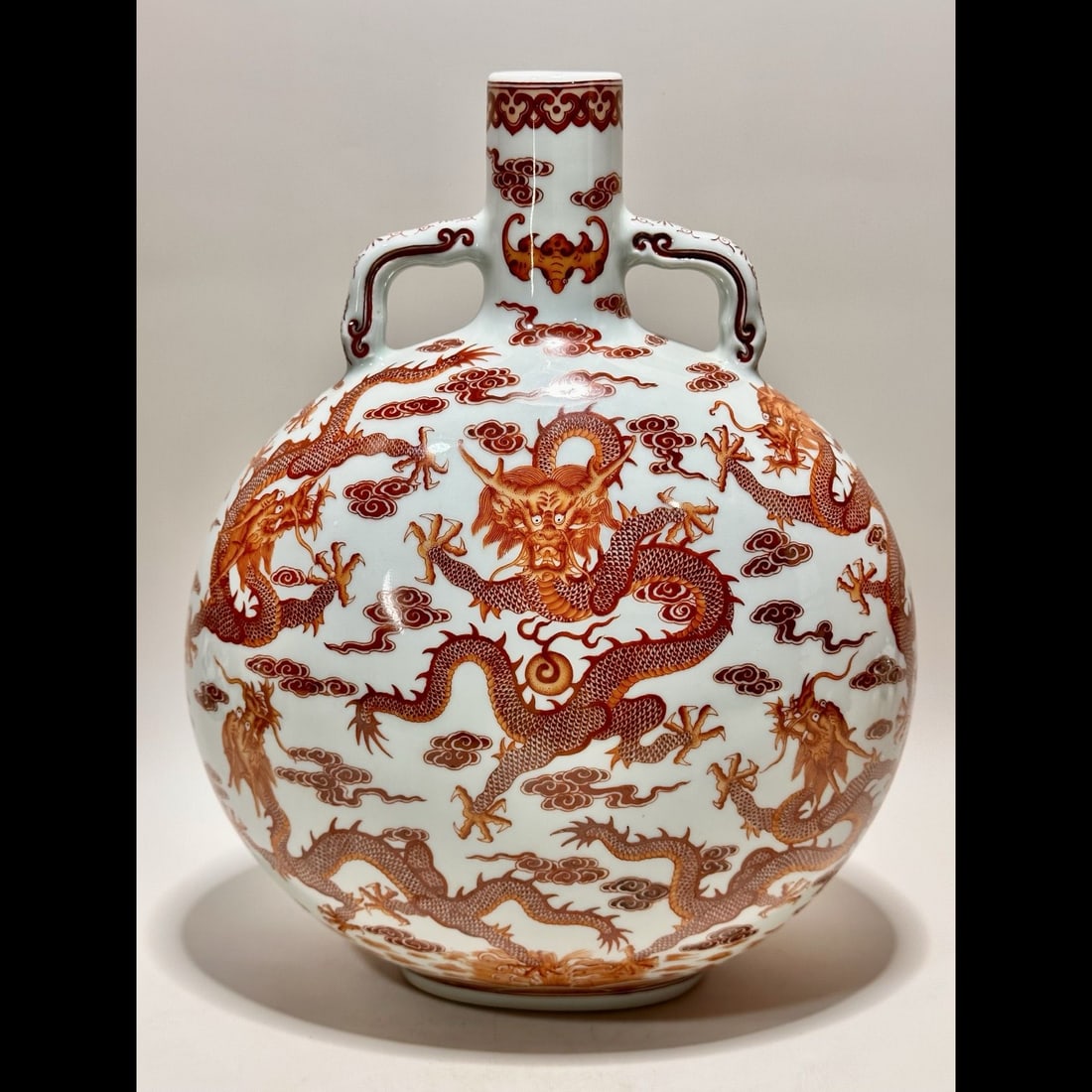 An Exquisite Iron-Red Dragon Pattern Ruyi-Ears Vase: An Exquisite Iron-Red Dragon Pattern Ruyi-Ears Vase,Qing Dynasty, China,Qianlong Six-character Mark,Size:12inx1.6inx9.7inx4.3in 矾红龙纹如意耳瓶,中