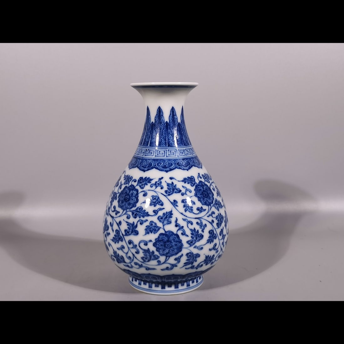 An Exquisite Blue and White Lotus Pattern Vase: An Exquisite Blue and White Lotus Pattern Vase,Qing Dynasty, China,Qianlong Six-character Mark,Size:6.6inx2.2inx4.1in