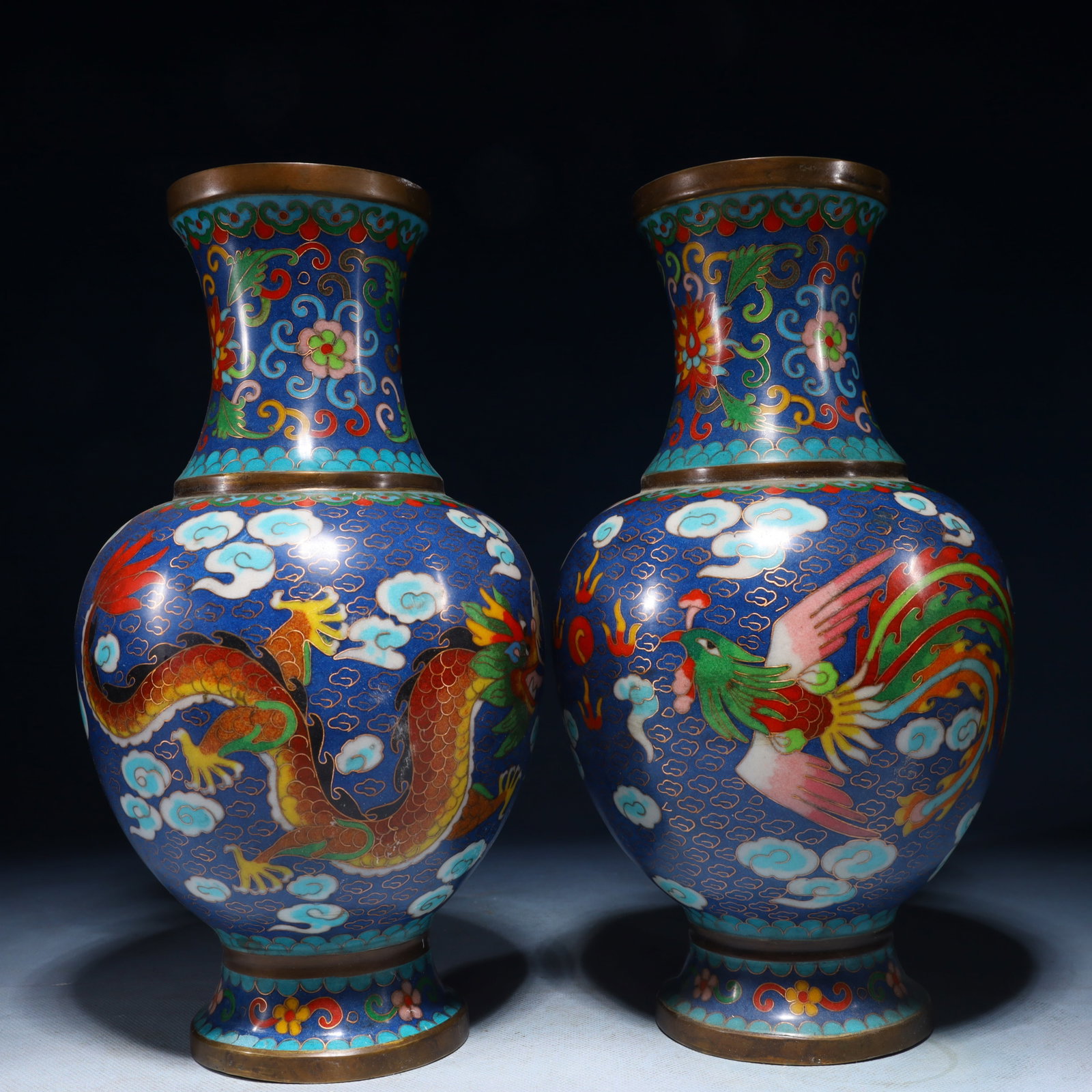 A Pair of Exquisite Cloisonne Dragon and Phoenix Pattern Vases: A Pair of Exquisite Cloisonne Dragon and Phoenix Pattern Vases,Qing Dynasty,China,Qianlong Four-character Mark,Size:5.9inx11.8in,Weight:4850g