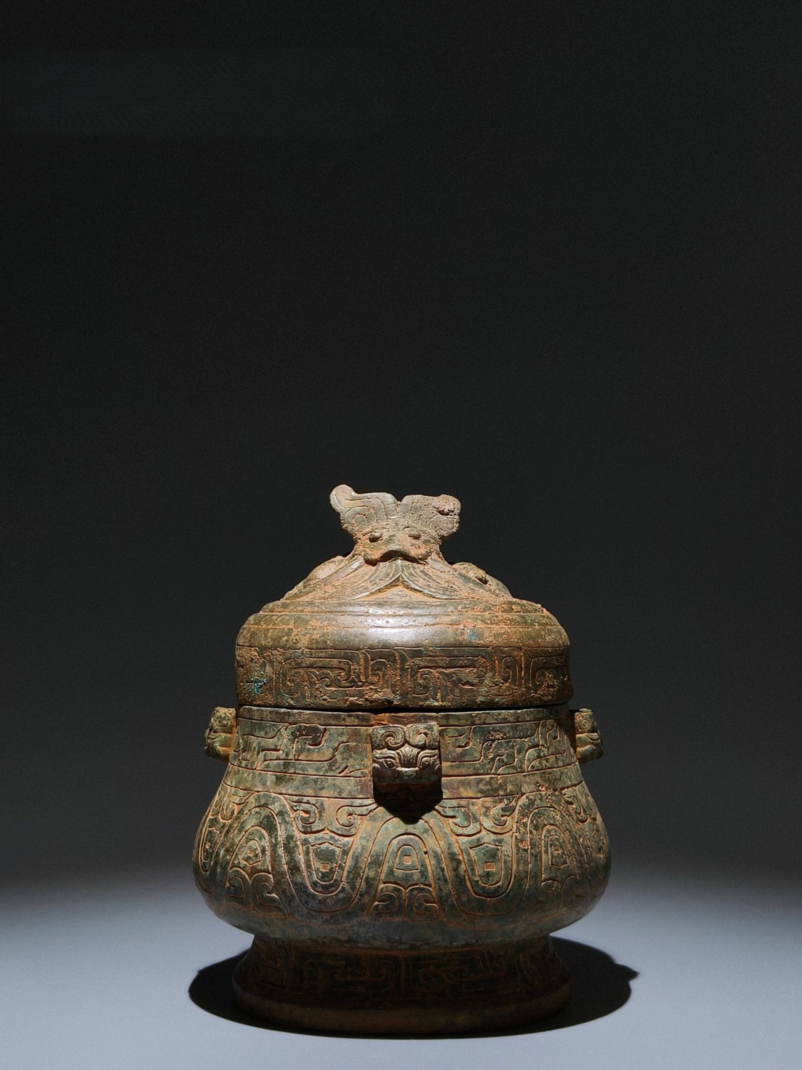 An Archaic Bronze Beast-Face Pattern Jar with Cover: An Archaic Bronze Beast-Face Pattern Jar with Cover,Shang Dynasty,China,Size:9.1inx6.7inx6.3in 青铜兽面纹盖罐,中国商代