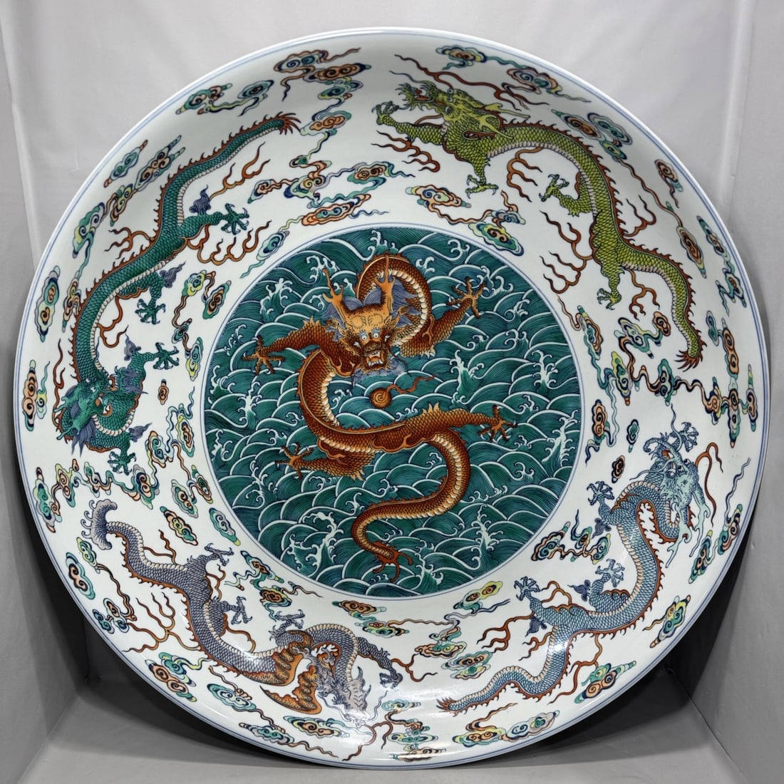A Huge Doucai Seawater Auspicious Cloud and Dragon Pattern Plate: A Huge Doucai Seawater Auspicious Cloud and Dragon Pattern Plate,Qing Dynasty,China,Qianlong Six-character Mark,Size:5.2inx27in