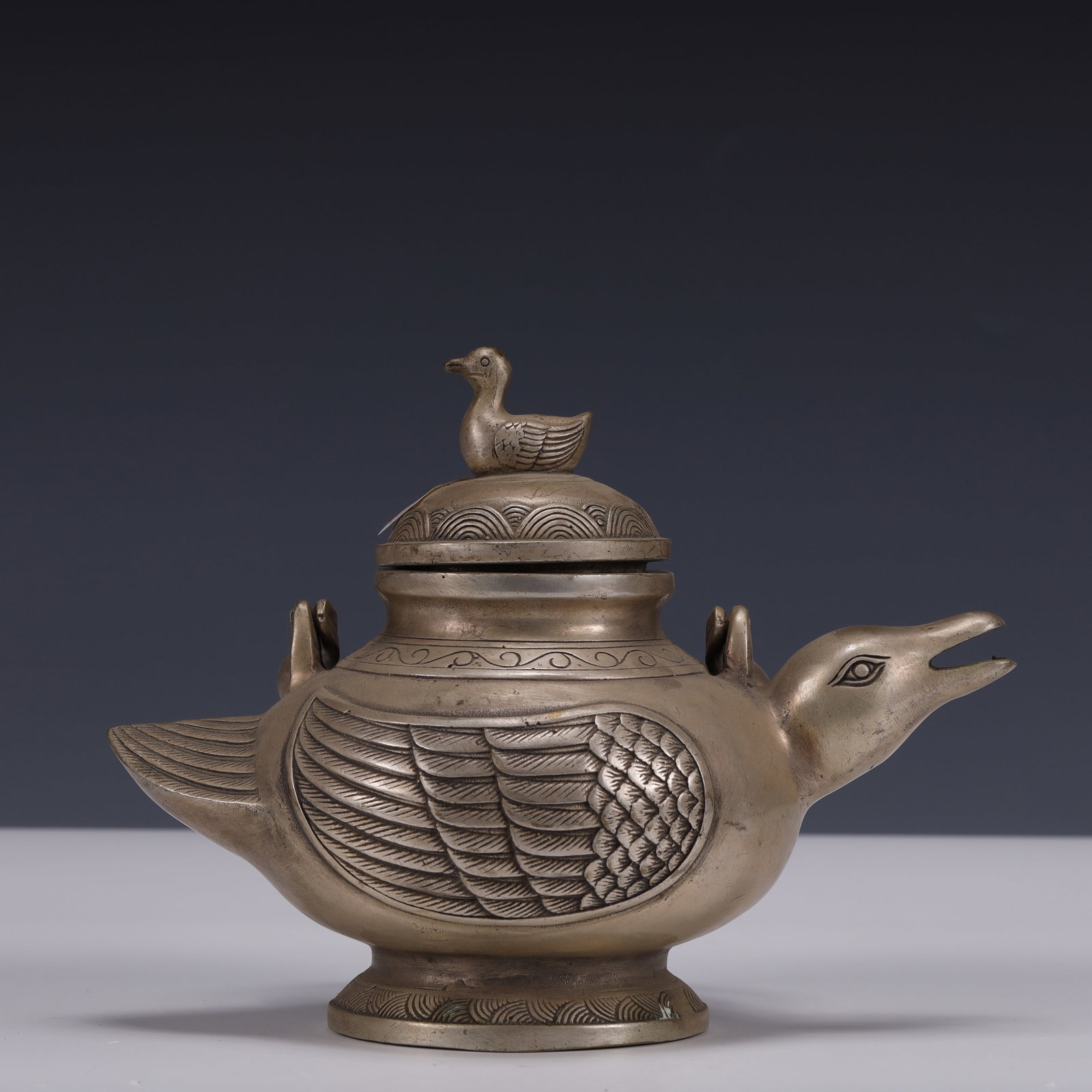 An Exquisite Silver-Plated Bronze Mandarin Duck Pattern Ewer: An Exquisite Silver-Plated Bronze Mandarin Duck Pattern Ewer,Qing Dynasty, China,Qianlong Four-character Mark,Size:7.9inx4.7inx6.7in,Weight:1250g 铜镀银鸳鸯纹ৗ