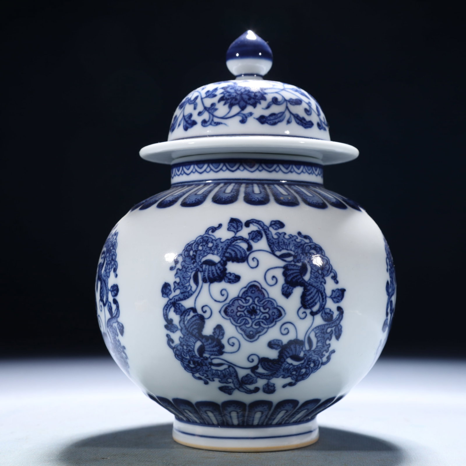 An Exquisite Blue and White Lotus Pattern Jar with Cover: An Exquisite Blue and White Lotus Pattern Jar with Cover,Qing Dynasty,China,Qianlong Six-character Mark,Size:4.7inx7.9in,Weight:1500g