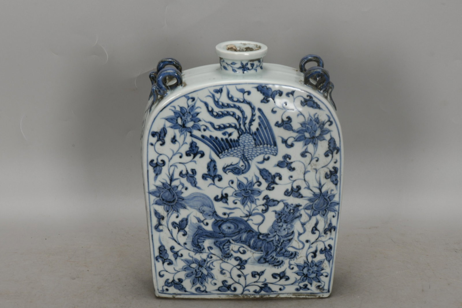 An Exquisite Blue and White Lotus and Phoenix Pattern Vase: An Exquisite Blue and White Lotus and Phoenix Pattern Vase,Yuan Dynasty,China,Size:9.8inx7.5in 青花缠枝莲凤纹瓶,中国元代