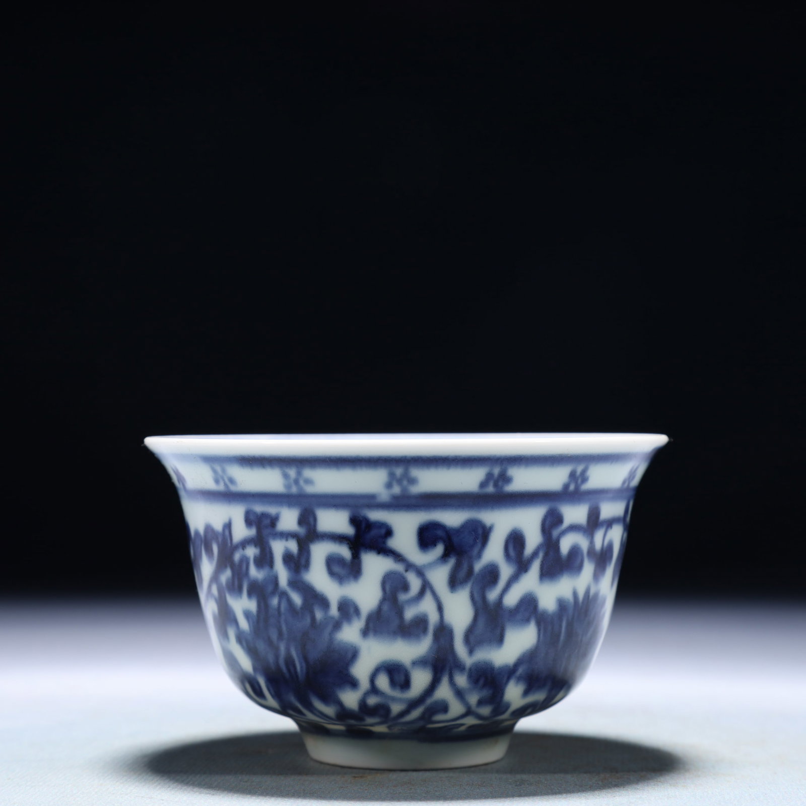 An Exquisite Blue and White Lotus Pattern Cup: An Exquisite Blue and White Lotus Pattern Cup,Qing Dynasty,China,Size:3.7inx2.4in,Weight:100g 青花缠枝莲纹杯子,中国清代
