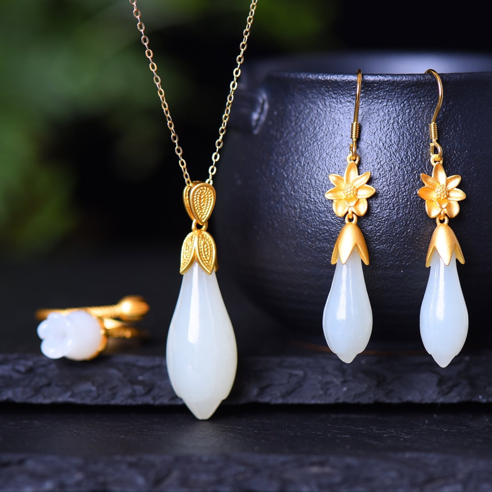 A Set of Fine Sterling Silver-Gold Plated Inlaid White Jade Jewelrys: A Set of Fine Sterling Silver-Gold Plated Inlaid White Jade Jewelrys,Size:(Pendant)0.5inx1.2in,(Ring)0.4inx0.4in,(Earrings)0.4inx0.7in 一套纯银镀金镶白&