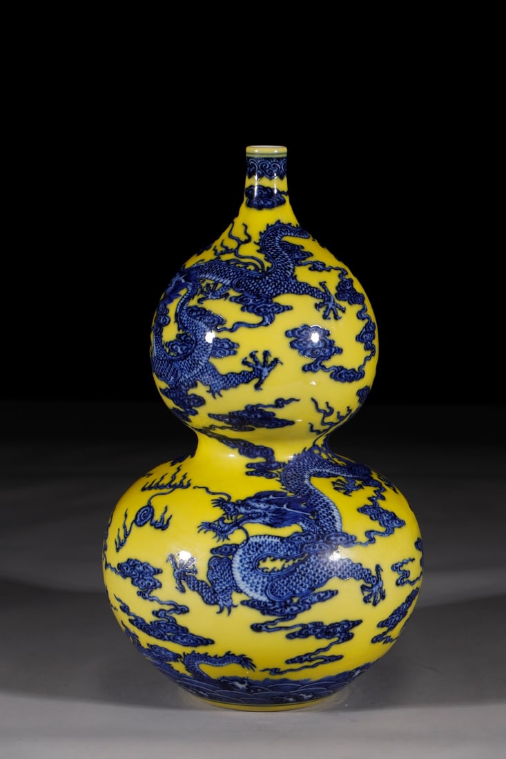 A Rare Yellow Ground Blue and White Auspicious Cloud and Dragon Pattern Gourd Vase: A Rare Yellow Ground Blue and White Auspicious Cloud and Dragon Pattern Gourd Vase,Qing Dynasty,China,Qianlong Six-character Mark,Size:13.8in