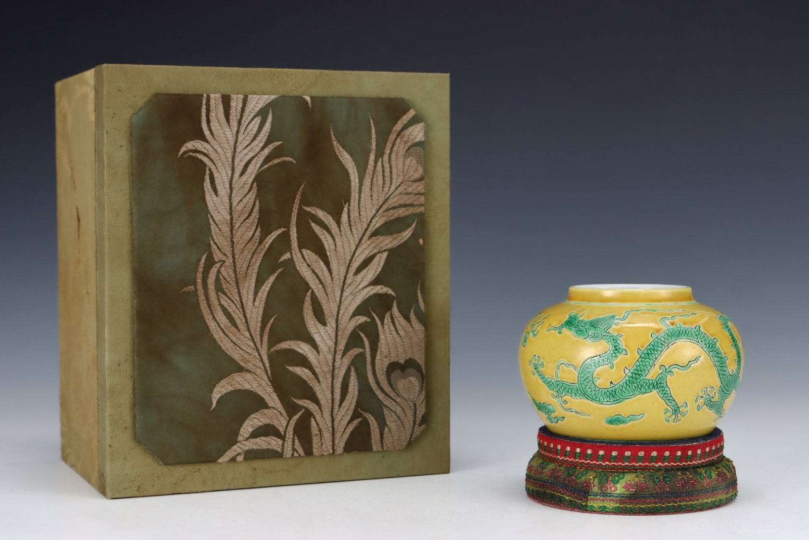 An Exquisite Yellow Ground Green Glazed Auspicious Cloud and Dragon Pattern Jar: An Exquisite Yellow Ground Green Glazed Auspicious Cloud and Dragon Pattern Jar,Ming Dynasty,China,Jiajing Six-character Mark,Size:3.1inx4.5in 黄地绿釉祥云龙&