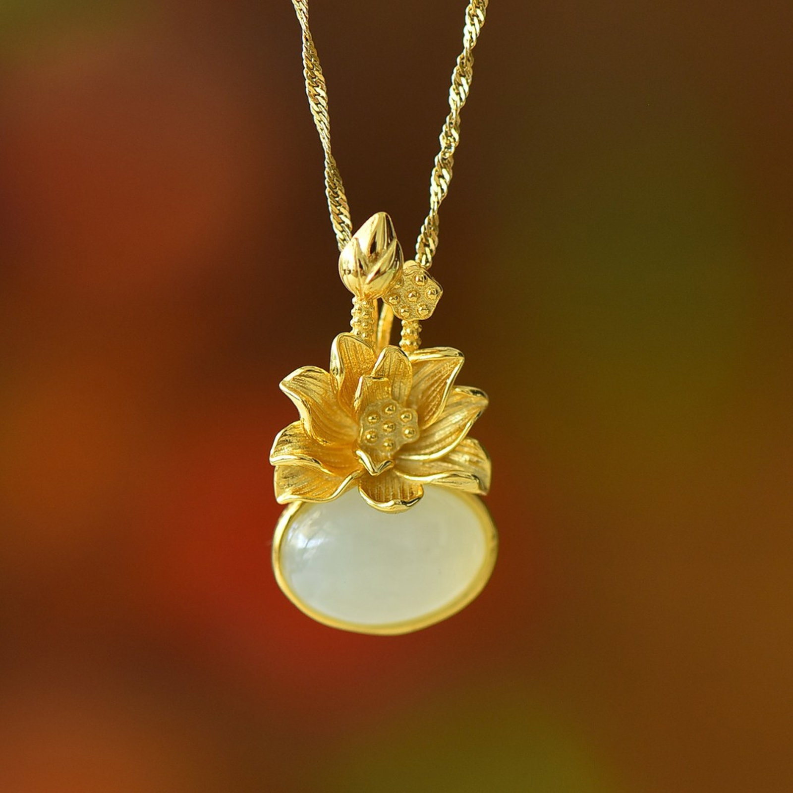 An Exquisite Sterling Silver-Gold Plated Inlaid White Jade Pendant: An Exquisite Sterling Silver-Gold Plated Inlaid White Jade Pendant 纯银镀金镶白玉吊坠