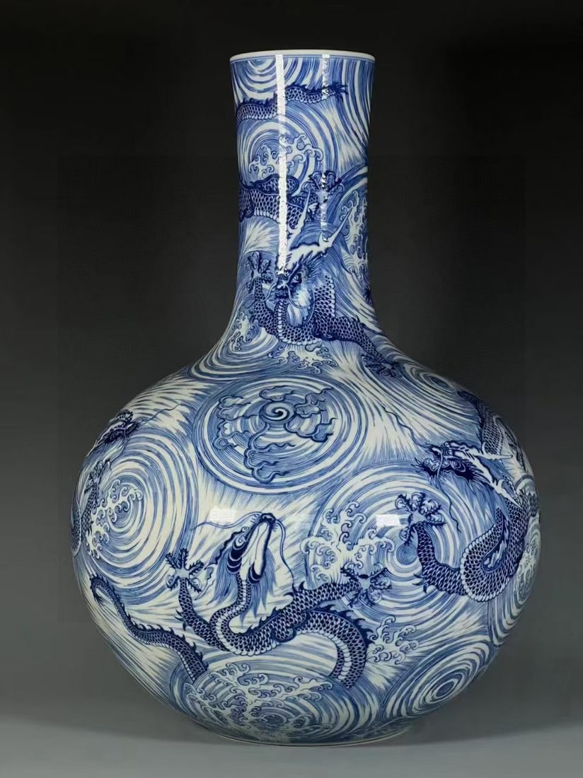 A Huge Blue and White Auspicious Cloud and Dragon Pattern Vase: A Huge Blue and White Auspicious Cloud and Dragon Pattern Vase,Qing Dynasty,China,Qianlong Six-character Mark,Size:18.1inx2.4inx5.6in 青花祥云龙纹瓶,中&