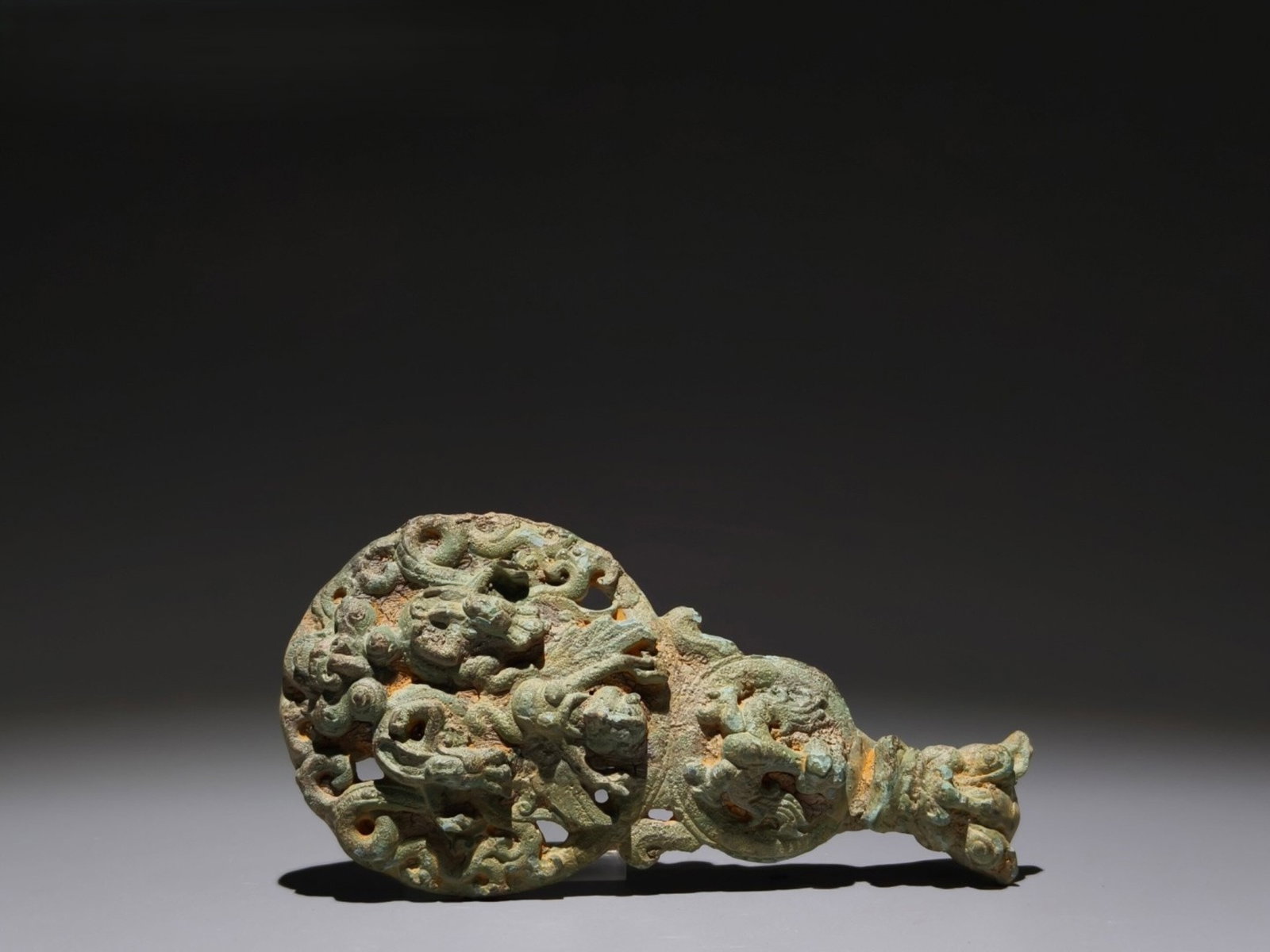 An Archaic Bronze Beast Pattern Ornament: An Archaic Bronze Beast Pattern Ornament,the Warring States period in China,Size:6.5inx3.3in 青铜兽纹摆件,中国战国时期