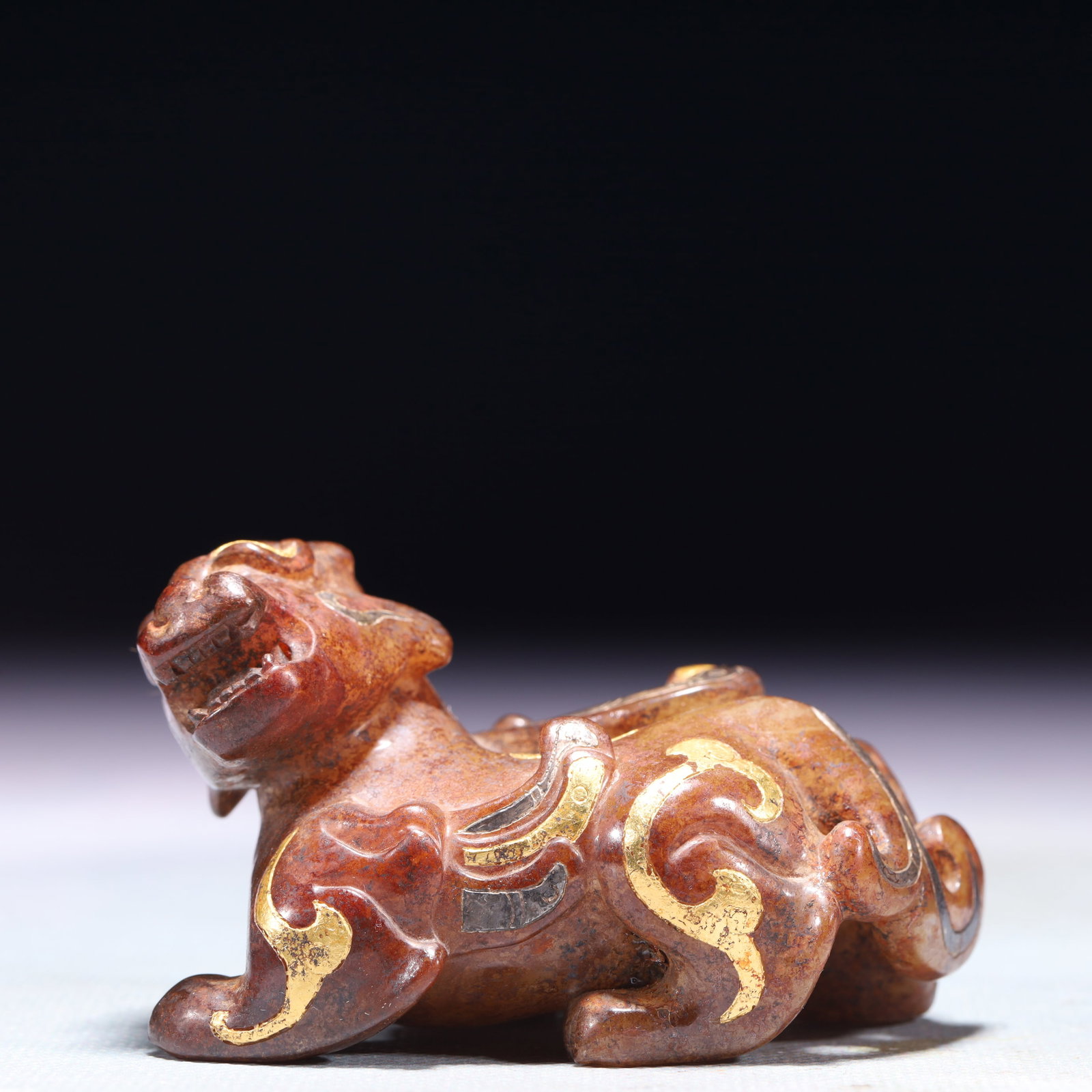 An Exquisite Archaic Jade Inlaid Gold and Silver Beast Ornament: An Exquisite Archaic Jade Inlaid Gold and Silver Beast Ornament,Ancient Time,China,Size:2.6inx1.8inx1.6in,Weight:138.9g 高古玉错金银兽摆件,中