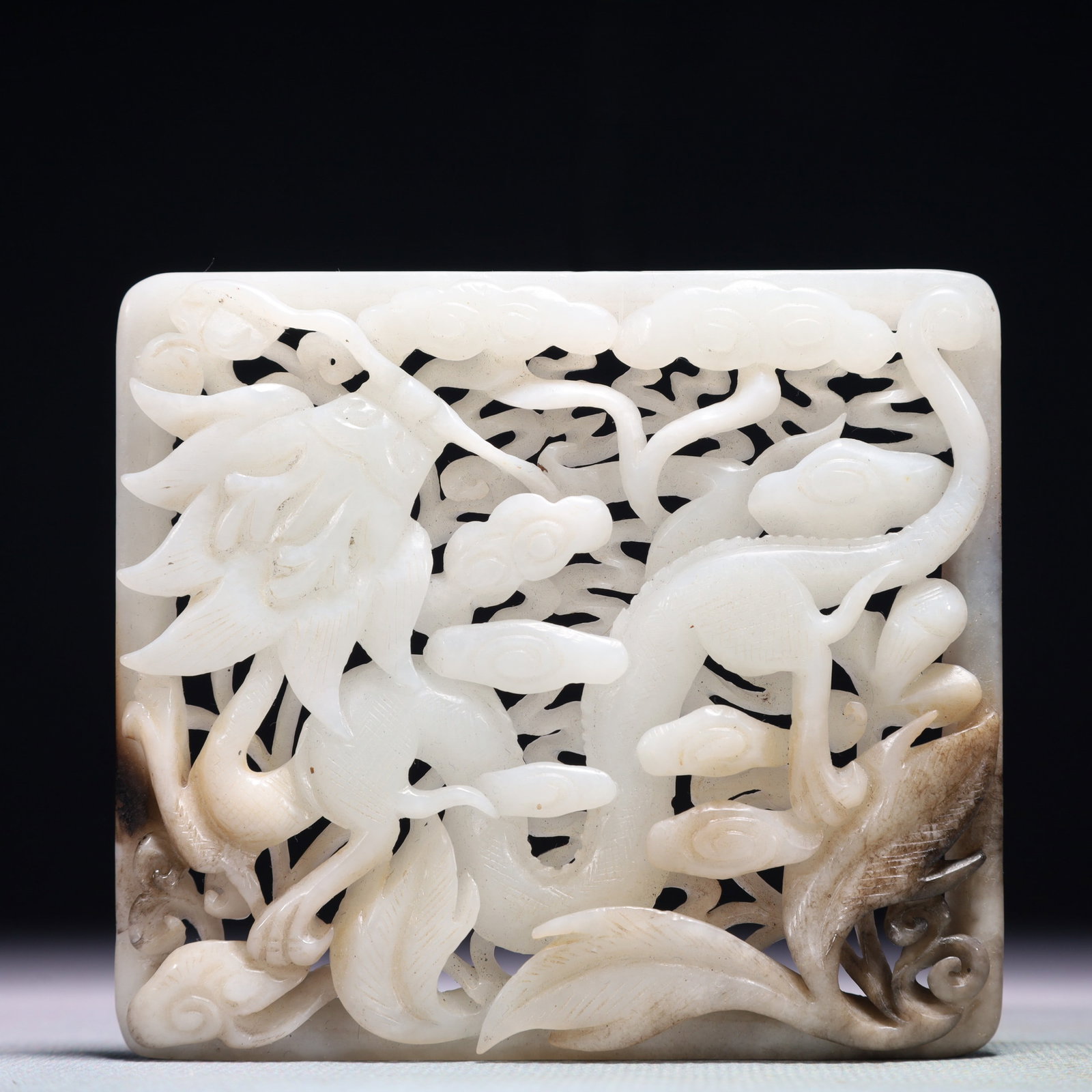 An Exquisite White Jade Auspicious Cloud and Dragon Pattern Pendant: An Exquisite White Jade Auspicious Cloud and Dragon Pattern Pendant,Qing Dynasty,China,Size:3.5inx3.1in,Weight:107.6g 白玉祥云龙纹佩,中国清&