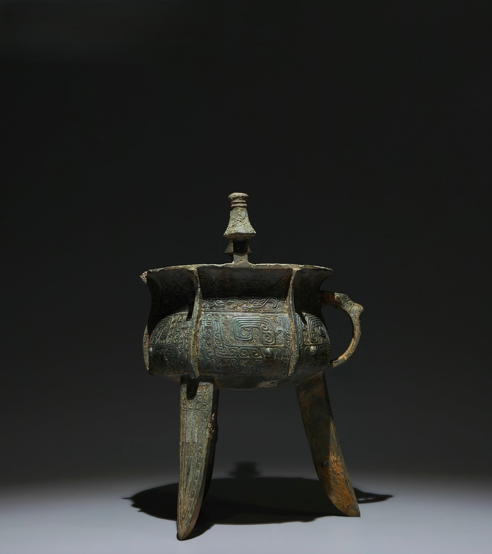 An Archaic Bronze Beast-Face Pattern Tripod Censer: An Archaic Bronze Beast-Face Pattern Tripod Censer,Western Zhou Dynasty,China,Size:10.8inx6.7in 青铜兽面纹三足香炉,中国西周