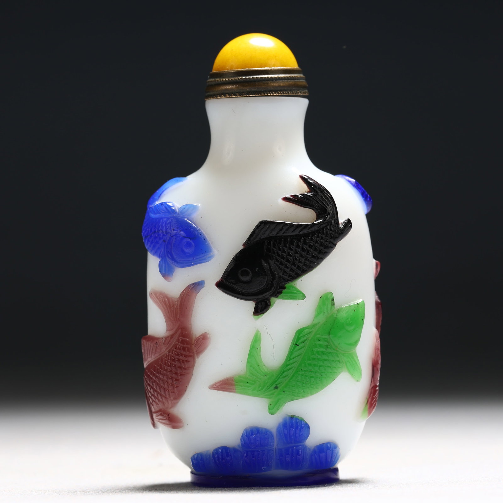 An Exquisite Glass Multi-Color Overlay Fish Pattern Snuff Bottle: An Exquisite Glass Multi-Color Overlay Fish Pattern Snuff Bottle,Qing Dynasty, China,Daoguang Four-character Mark,Size:1.5inx0.8inx2.8in 琉璃套彩鱼纹鼻烟