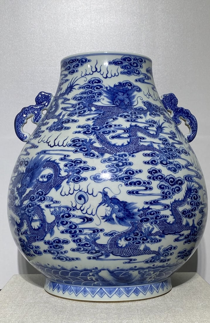 A Rare Blue and White Auspicious Cloud and Dragon Pattern Double-Ears Vase: A Rare Blue and White Auspicious Cloud and Dragon Pattern Double-Ears Vase,Qing Dynasty,China,Qianlong Six-character Mark,Size:15inx13.8in
