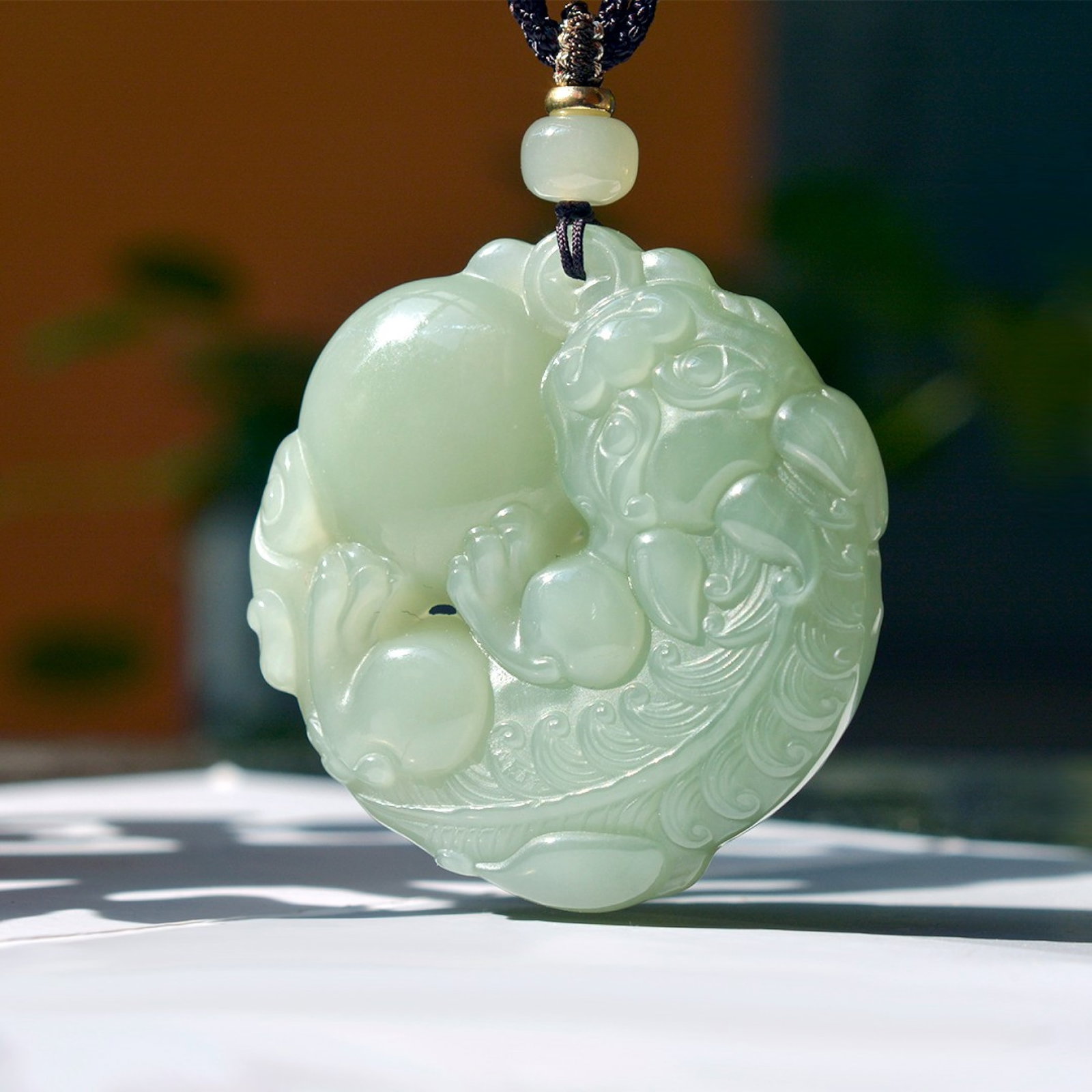 An Exquisite Greenish Jade Wealth-Attracting Creature Pendant: An Exquisite Greenish Jade Wealth-Attracting Creature Pendant,Size:1.9inx1.9in 青玉貔貅挂件