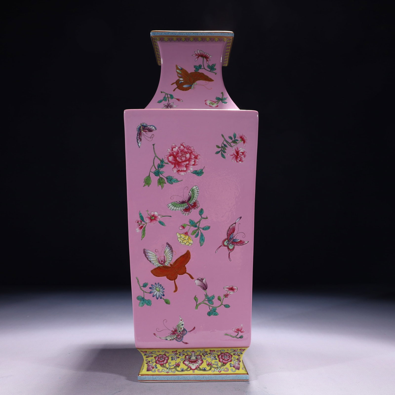 An Exquisite Pink Ground Famille-Rose Painted Gold Flower and Butterfly Pattern Vase: An Exquisite Pink Ground Famille-Rose Painted Gold Flower and Butterfly Pattern Vase,Qing Dynasty,China,Qianlong Six-character Mark,Size:5.9inx16.1in,Weight:4150g