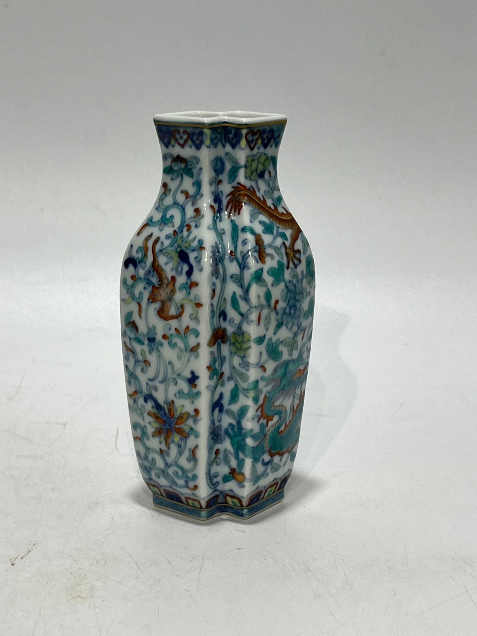 An Exquisite Blue and White Doucai Lotus and Dragon Pattern Vase: An Exquisite Blue and White Doucai Lotus and Dragon Pattern Vase,Qing Dynasty,China,Qianlong Six-character Mark,Size:5.5in