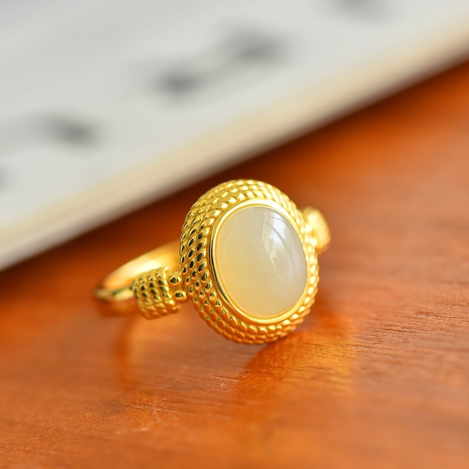 An Exquisite Sterling Silver-Gold Plated Inlaid White Jade Ring: An Exquisite Sterling Silver-Gold Plated Inlaid White Jade Ring , Size :0.3inx0.4in 纯银镀金镶白玉戒指,尺寸:0.3inx0.4in
