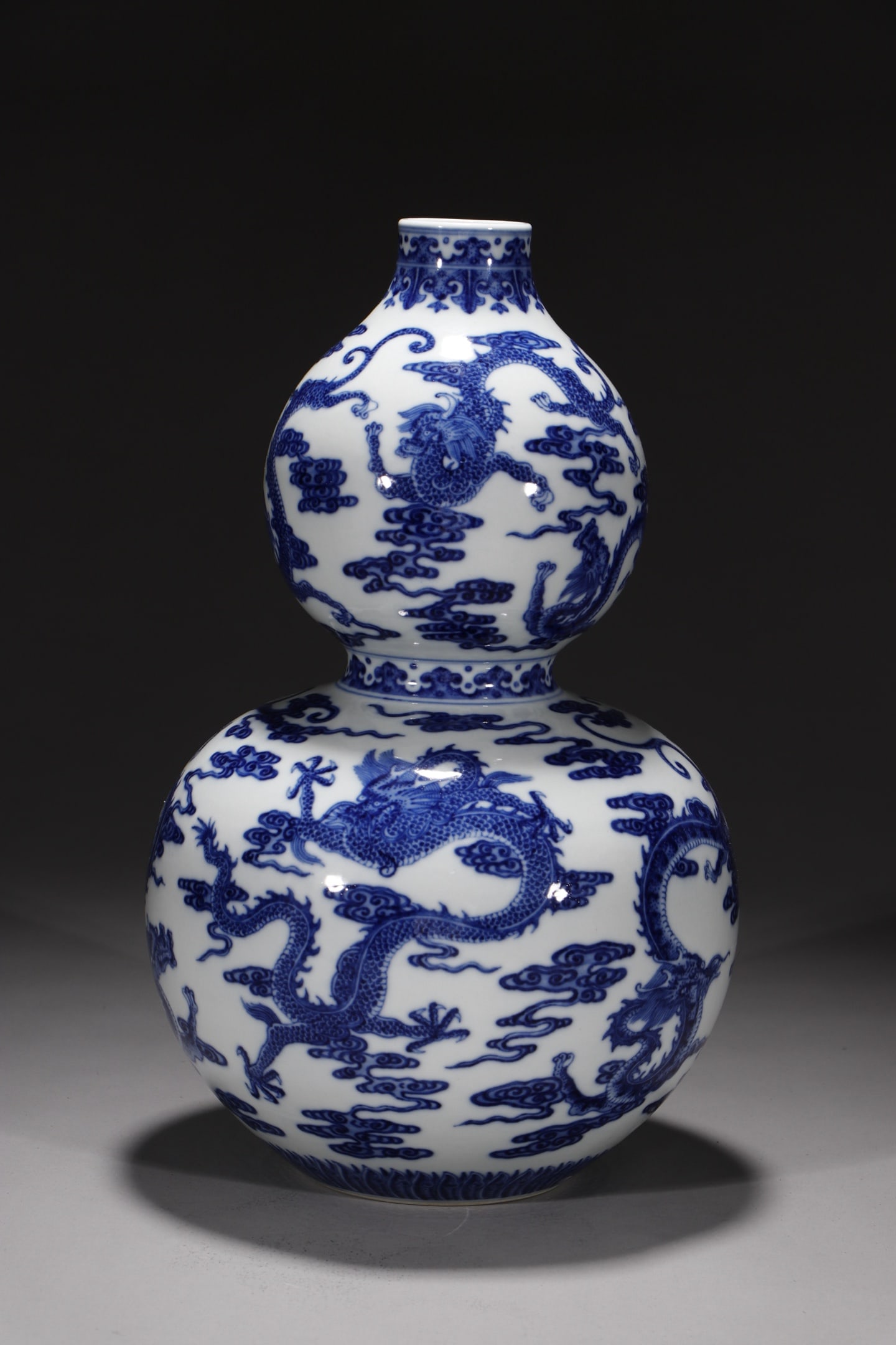 A Rare Blue and White Auspicious Cloud and Dragon Pattern Gourd Vase: A Rare Blue and White Auspicious Cloud and Dragon Pattern Gourd Vase,Qing Dynasty,China,Qianlong Six-character Mark,Size:13in