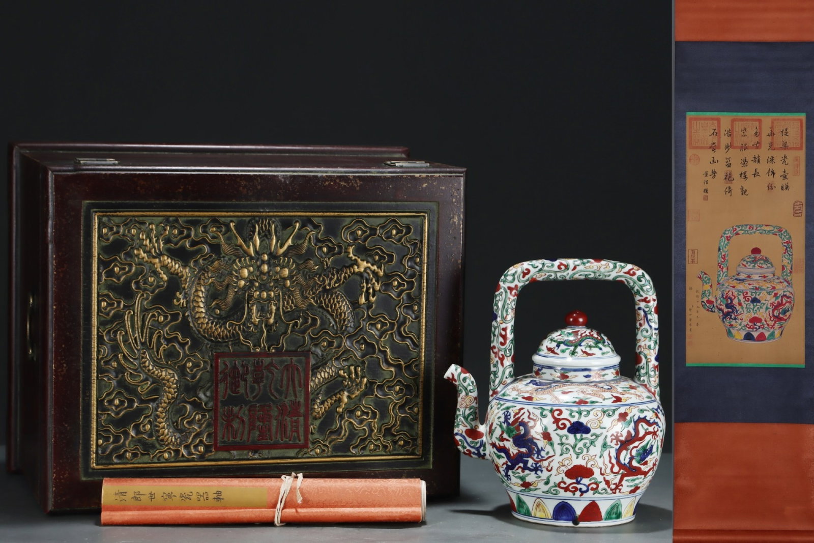 A Rare Wucai Lotus and Dragon Pattern Loop-Handled Pot,with Chinese Vertical Scroll Ink Painting on: A Rare Wucai Lotus and Dragon Pattern Loop-Handled Pot,with Chinese Vertical Scroll Ink Painting on Silk,Ming Dynasty,China,Wanli Six-character Mark,Size:(Without