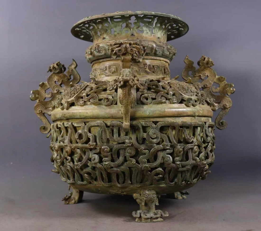 A Rare Bronze Hollow Beast-Ears Tripod Jar,With Inscription: A Rare Bronze Hollow Beast-Ears Tripod Jar,With Inscription,the Warring States period in